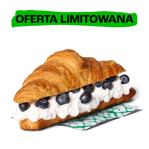Chrupiący croissant z bitą śmietaną i świeżymi borówkami, promowany jako oferta limitowana.