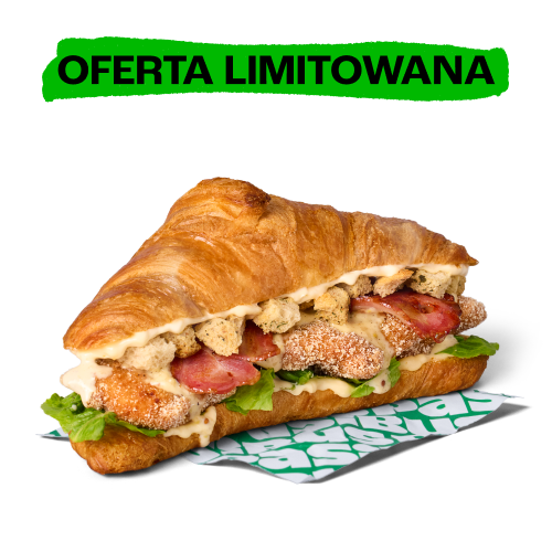 Kanapka z croissanta z kurczakiem, boczkiem i sosem. U góry zielony napis „OFERTA LIMITOWANA”.