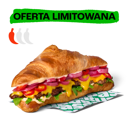 Croissant burger z mięsem, serem, czerwoną cebulą i chili. Nad nim zielony baner z napisem „Oferta limitowana”.